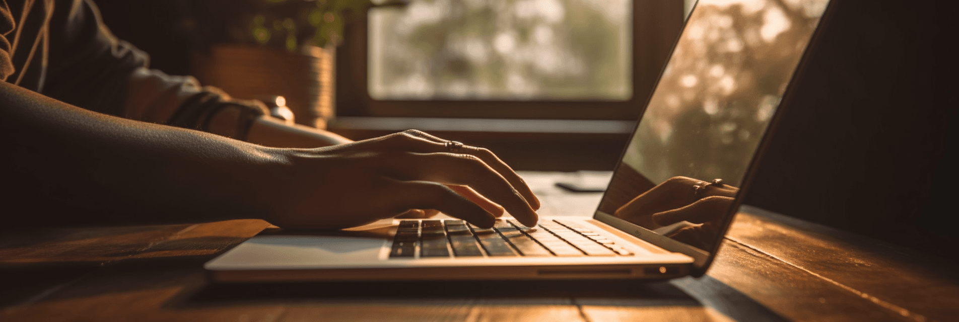 Closeup of person typing on laptop